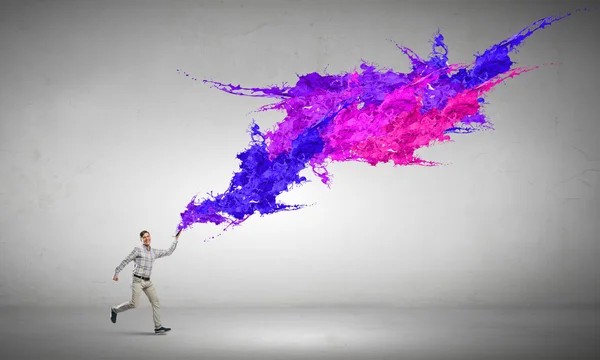 Man running with book — Stock Photo, Image