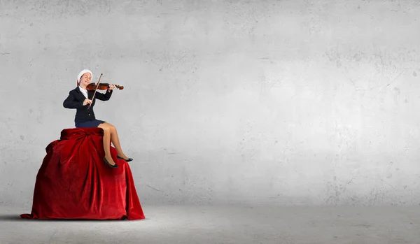 Santa woman play violin — Stock Photo, Image