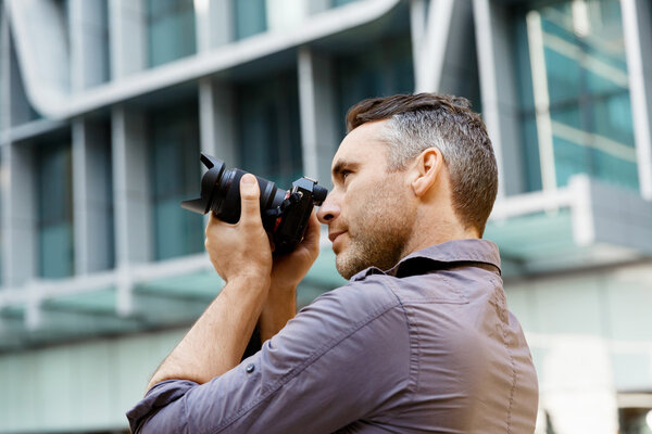 Male photographer taking picture