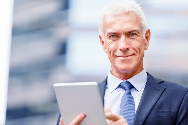 Senior businessman holding touchpad — Stock Photo, Image