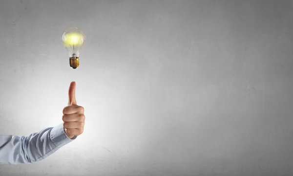 Man pointing light bulb — Stock Photo, Image