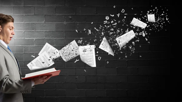 Businessman with opened book — Stock Photo, Image