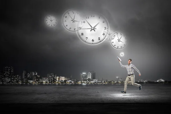 Man running with book — Stock Photo, Image