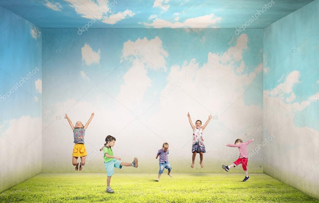 Playful children catch balloons