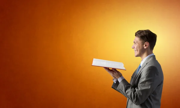 Businessman with red book — Stock Photo, Image