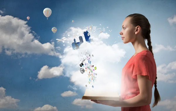 Girl holding opened book — Stock Photo, Image