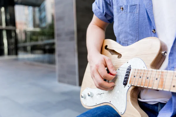 Hands of musician with guitar — Stock Photo, Image