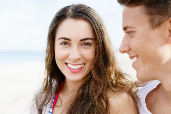 Romantic young couple sitting on the beach Royalty Free Stock Photos