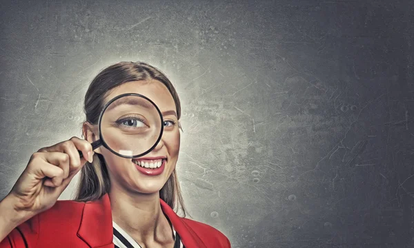 Girl using magnifier for search — Stock Photo, Image