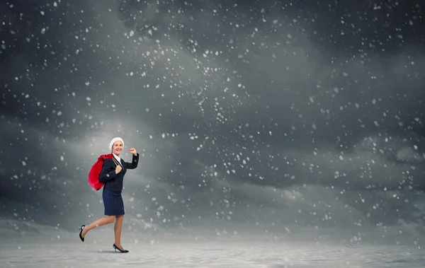 Santa kvinna med säck — Stockfoto