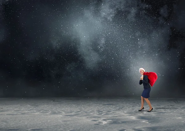 Santa kvinna med säck — Stockfoto