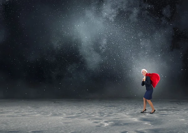 Weihnachtsmann Frau mit Sack — Stockfoto