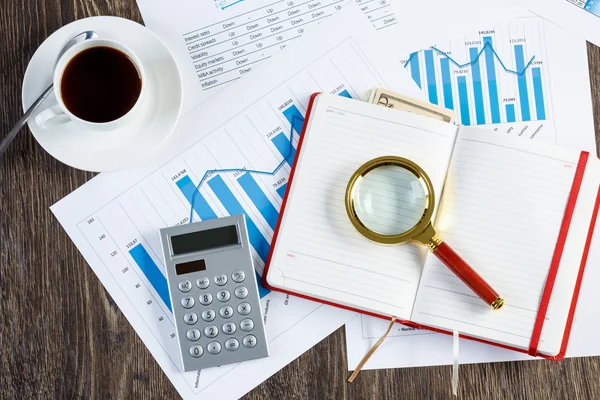 Financial charts and graphs on the table — Stock Photo, Image