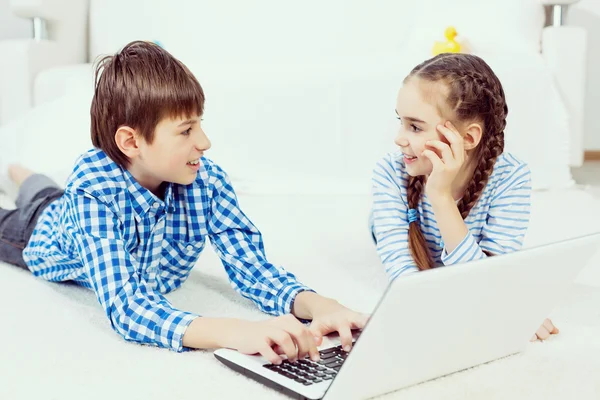 Cute kids using devices — Stock Photo, Image