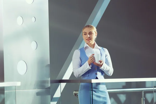 Attractive woman in office building — Stock Photo, Image