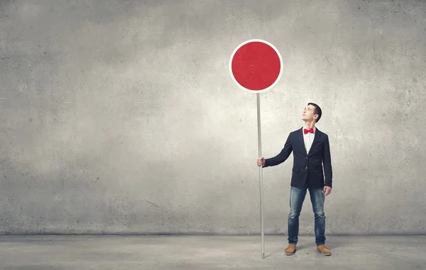 Guy showing roadsign — Stock Photo, Image