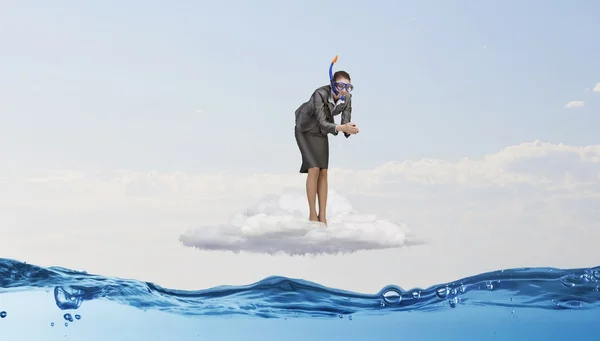 Businesswoman jumping in water — Stock Photo, Image