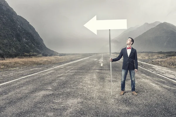 Guy showing roadsign — Stock Photo, Image