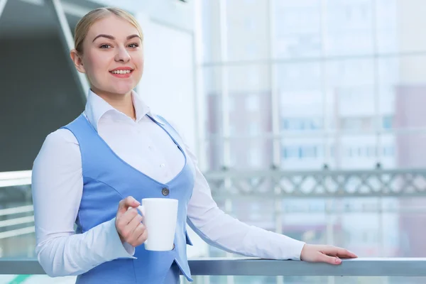 Attractive woman in office building — Stock Photo, Image