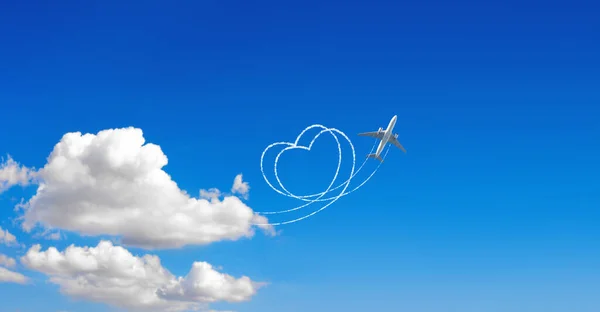 Aircraft draw a heart in the sky. Flight route of aircraft in shape of a heart. Love concept for traveling the world