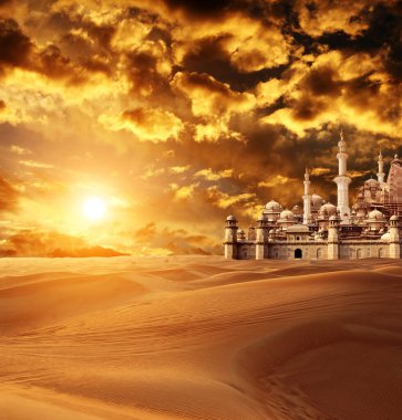 A fabulous lost city in the desert. Fantastic oriental town in the sands on beautiful sunset sky background. Photo toned in orange color clipart