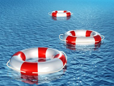 dalgalar üzerinde yüzen üç lifebuoys