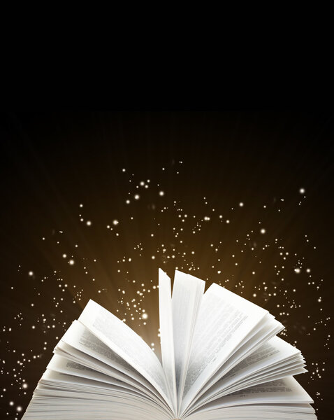 Open book and magic sparks on black background
