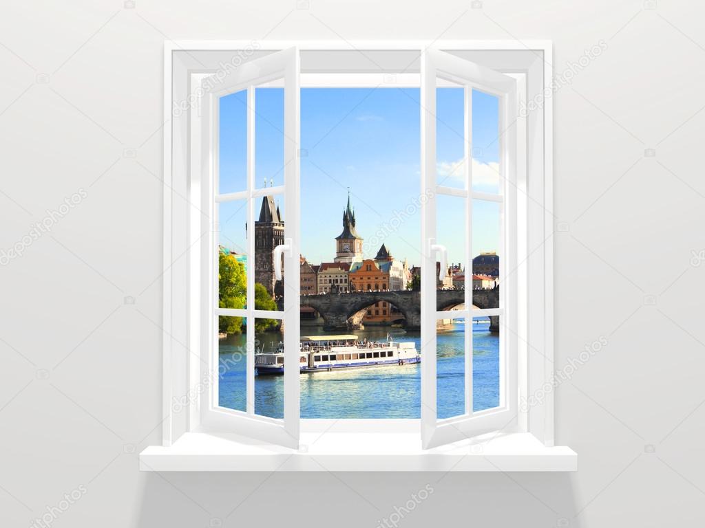 Opened window and view on Charles bridge, Prague, Czech Republic