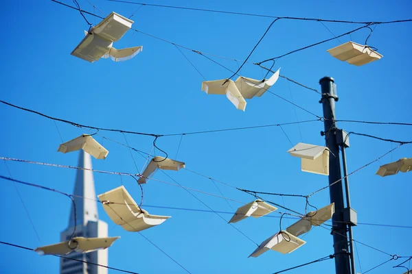 Flying books over blue sky in San Francisco, USA — Stock Photo, Image