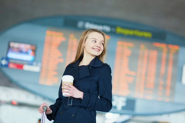 Young woman in international airport — Stock Photo, Image