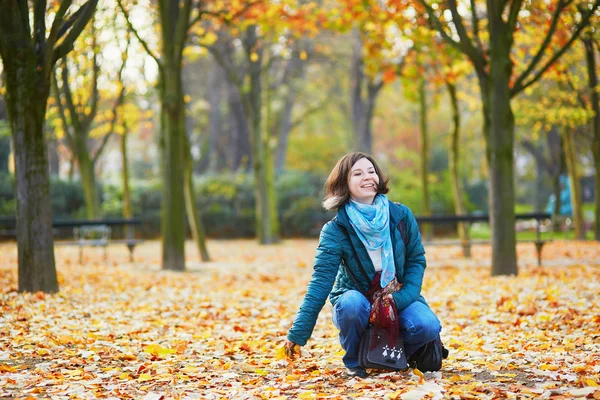 Cheerful young Parisian girl on a sunny fall Stock Image