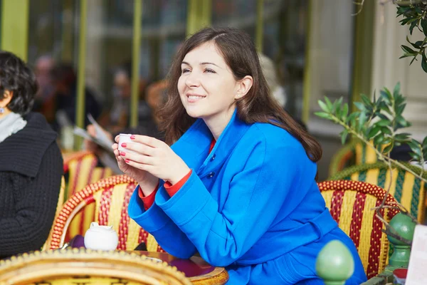 Beautiful young Parisian girl in cafe — Stock Photo, Image