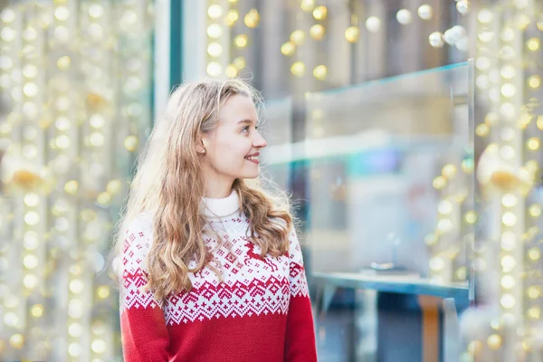 Young woman on a street of Paris decorated for Christmas — Stock Photo, Image