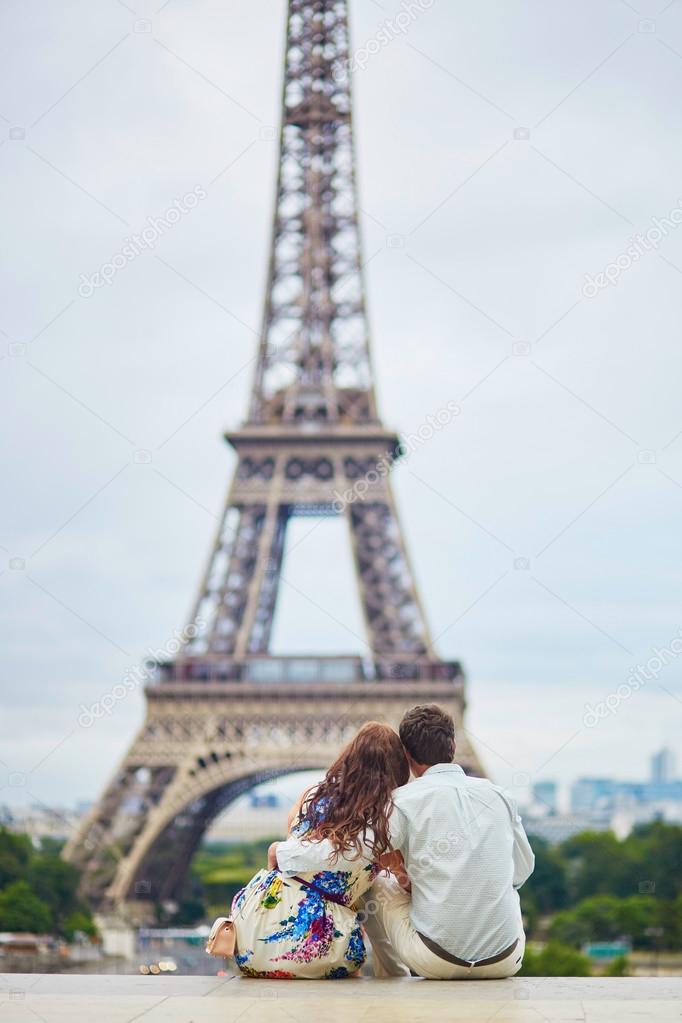 Romantic loving couple having a date near the Eiffel tower