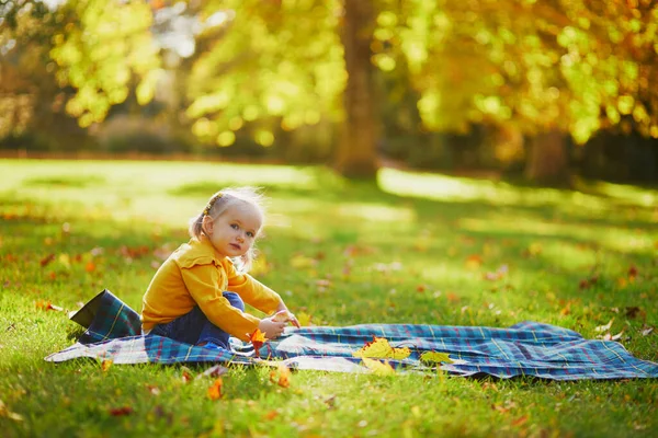 Adorable Toddler Girl Sitting Ground Eating Snack Autumn Park Happy — Stock Photo, Image