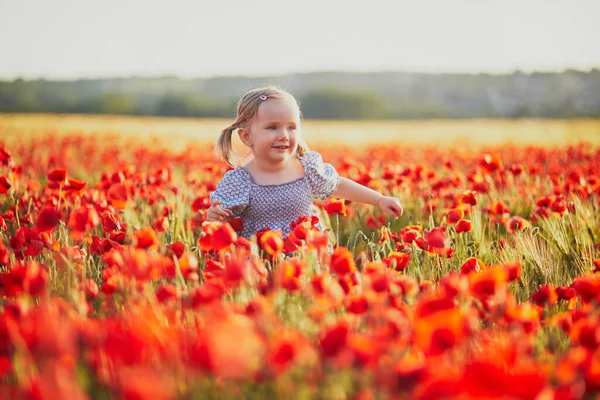 Adorable Toddler Girl Blue Dress Walking Field Blooming Poppies Happy — Stock Photo, Image