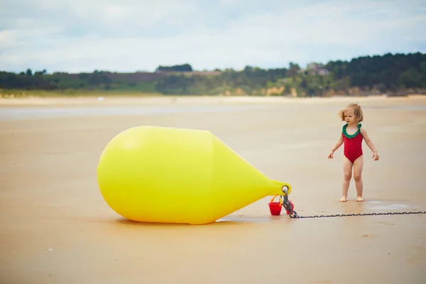 Adorable Toddler Girl Playing Sand Beach Large Yellow Buoy Atlantic — Stock Photo, Image