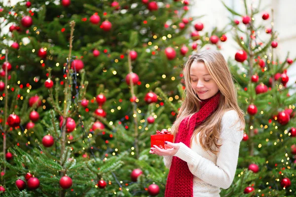 Girl with a Christmas present — Stock Photo, Image