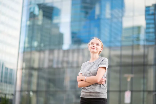 Young woman in modern glass office interior — Stock Photo, Image