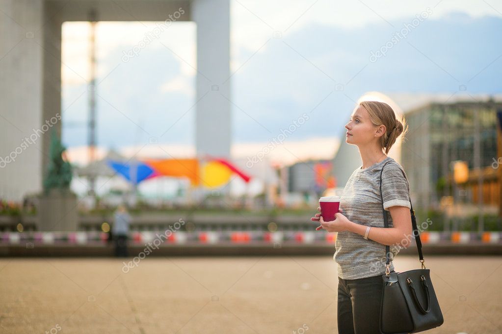 Girl walking at La Defense in Paris