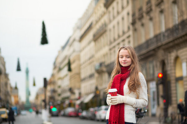 Girl with coffee on a street