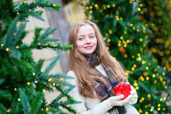 Cheerful girl with Christmas present — Stock Photo, Image