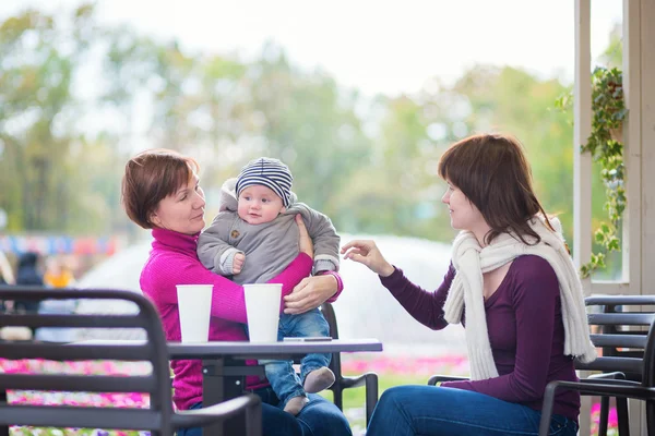 Grandmother, mother and little son in cafe — Stock Photo, Image