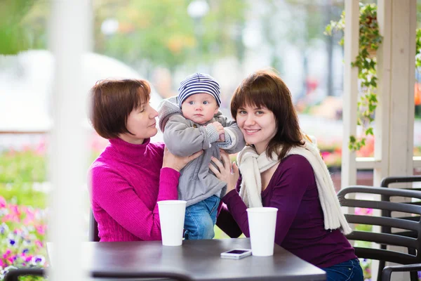Grandmother, mother and little son in cafe — Stock Photo, Image