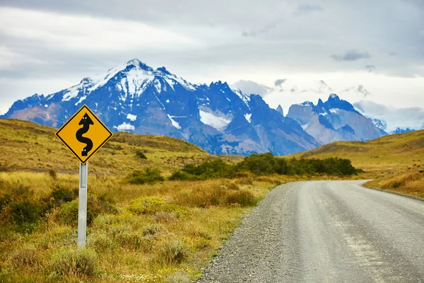 Winging road sign in Torres del Paine — Stock Photo, Image