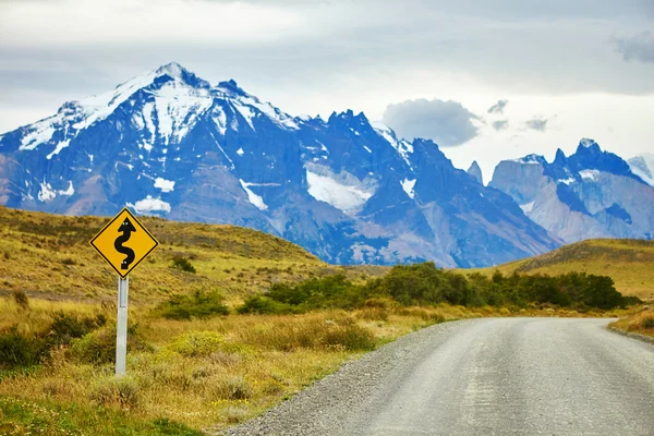 Winging road sign in Torres del Paine — Stock Photo, Image
