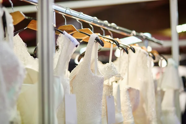 Collection of wedding dresses in a shop — Stock Photo, Image