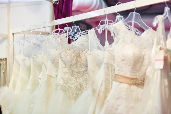 Collection of wedding dresses in a shop — Stock Photo, Image