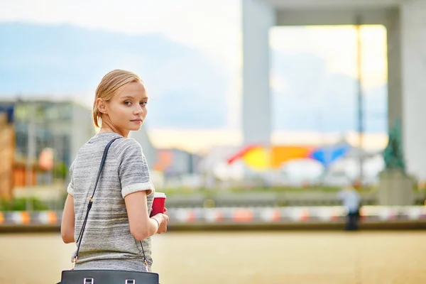 Girl with take-away coffee at La Defense in Paris — Stock Photo, Image