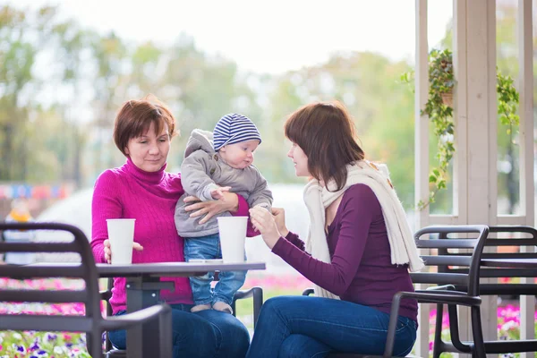 Grandmother, mother and little son in cafe — Stock Photo, Image